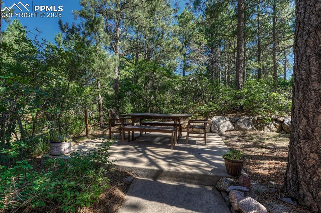 Image 23 of 48: Beautiful sitting area OR pad ready for hot tub!