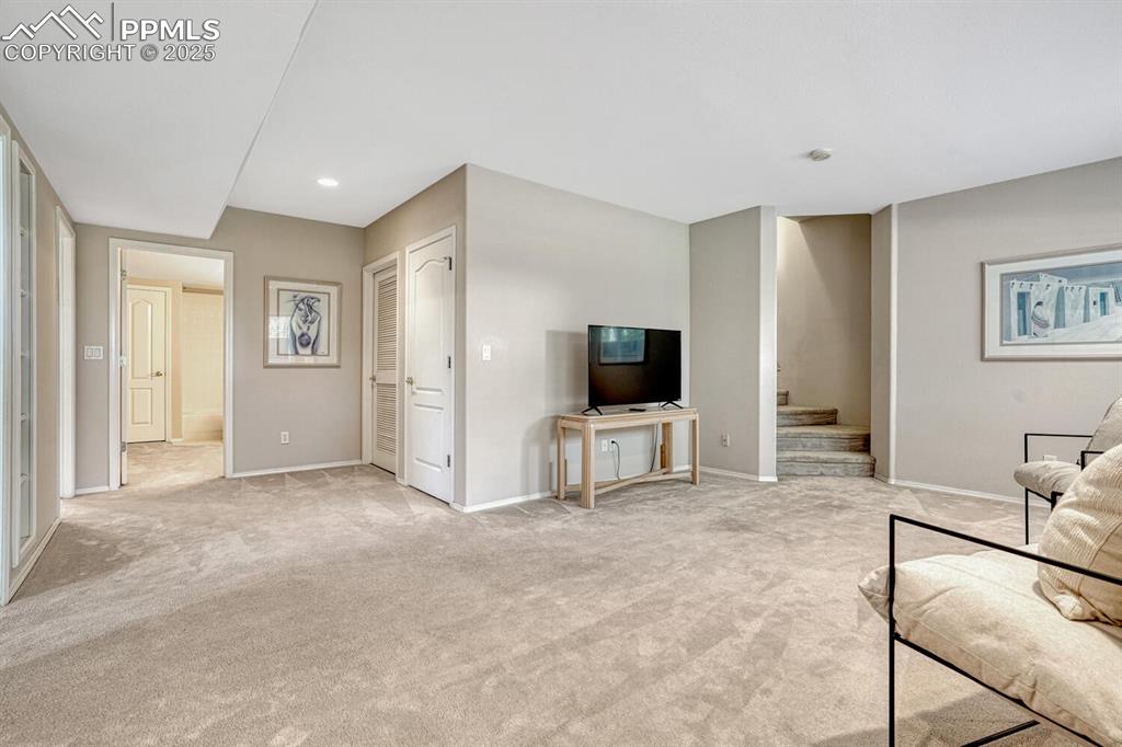 Image 36 of 48: Bright recreation room in garden level basement