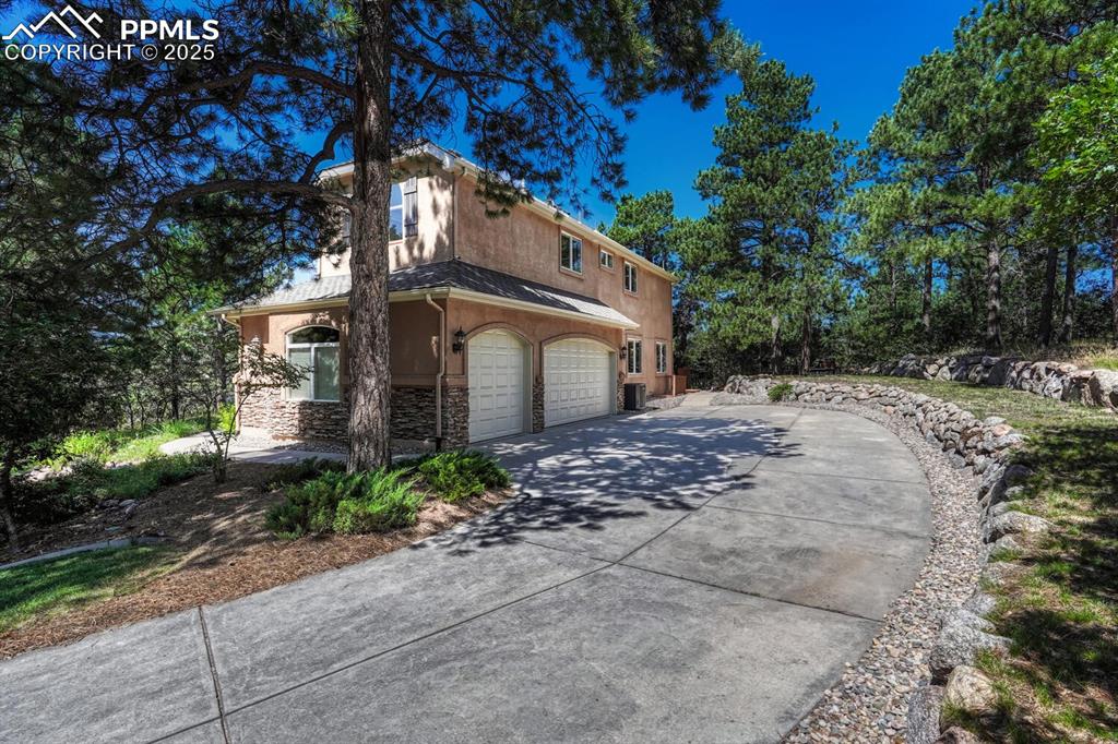 Image 45 of 48: Oversized 3 car garage with natural light.