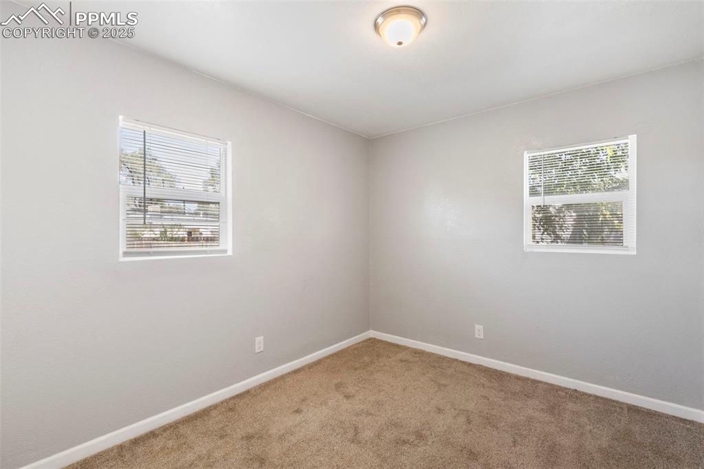 Image 10 of 25: Room featuring carpet floors and baseboards