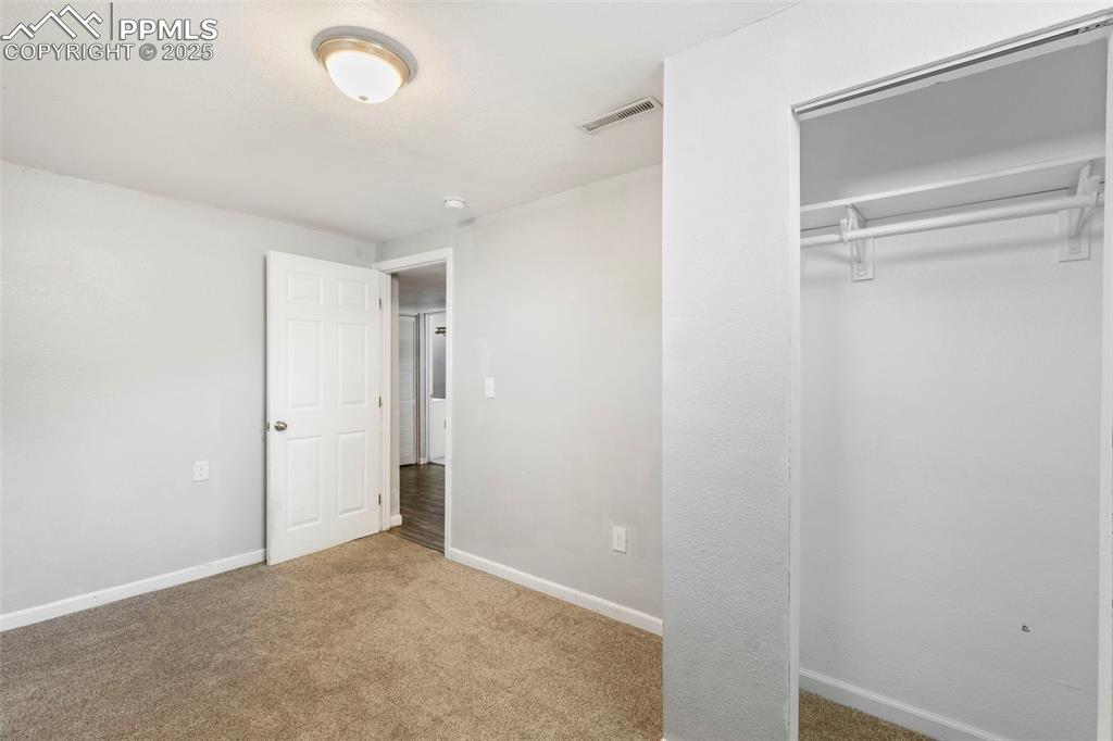Image 19 of 25: Room featuring carpet flooring and a closet
