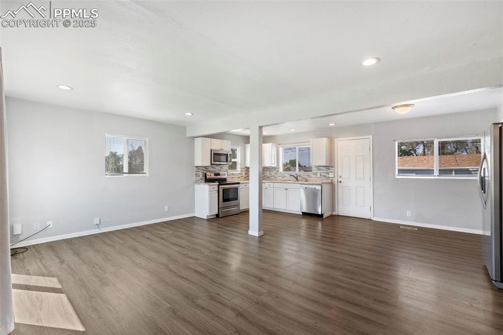 Image 3 of 25: Unfurnished living room featuring recessed lighting, plenty of natural ligh
