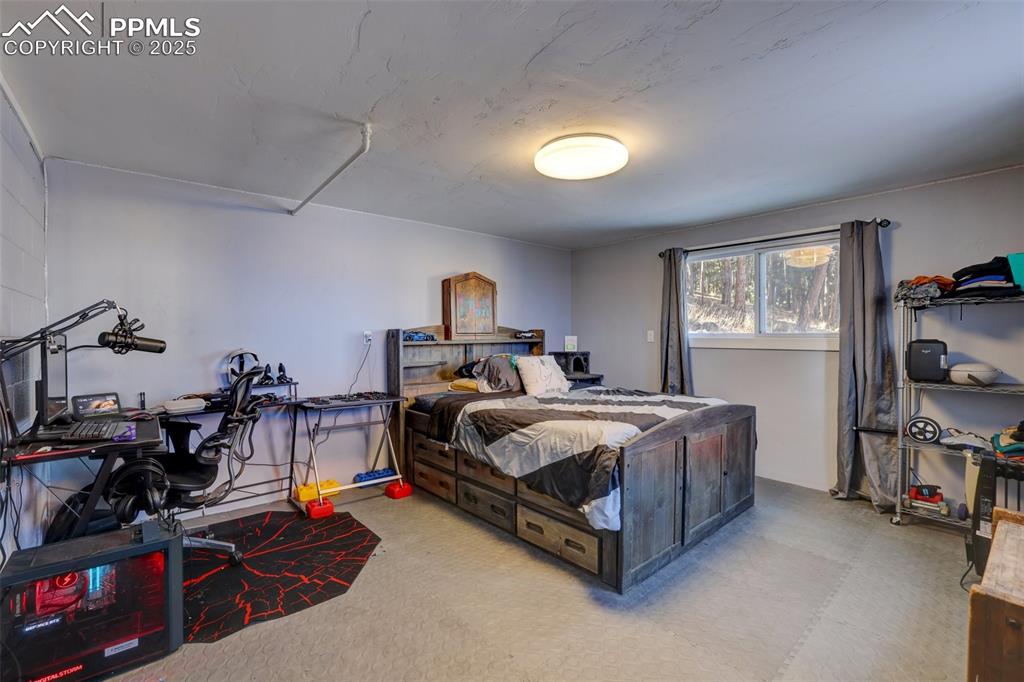 Image 37 of 50: Separated bedroom on the front of the red outbuilding