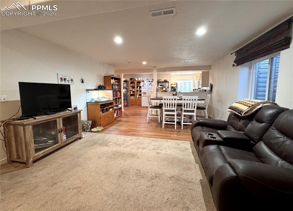 Image 22 of 35: Basement Living room and dining room
