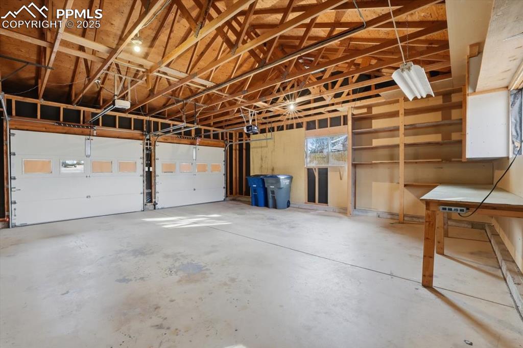 Image 44 of 50: Garage with a garage door opener