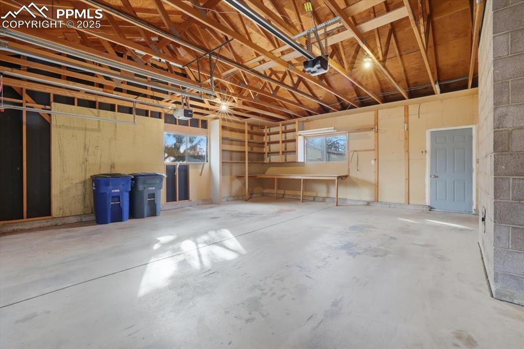 Image 45 of 50: Garage with a garage door opener