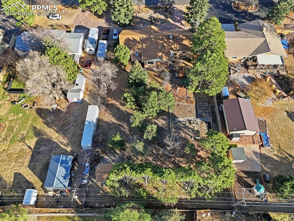 Image 9 of 50: Aerial view of property and surrounding area with nearby suburban area