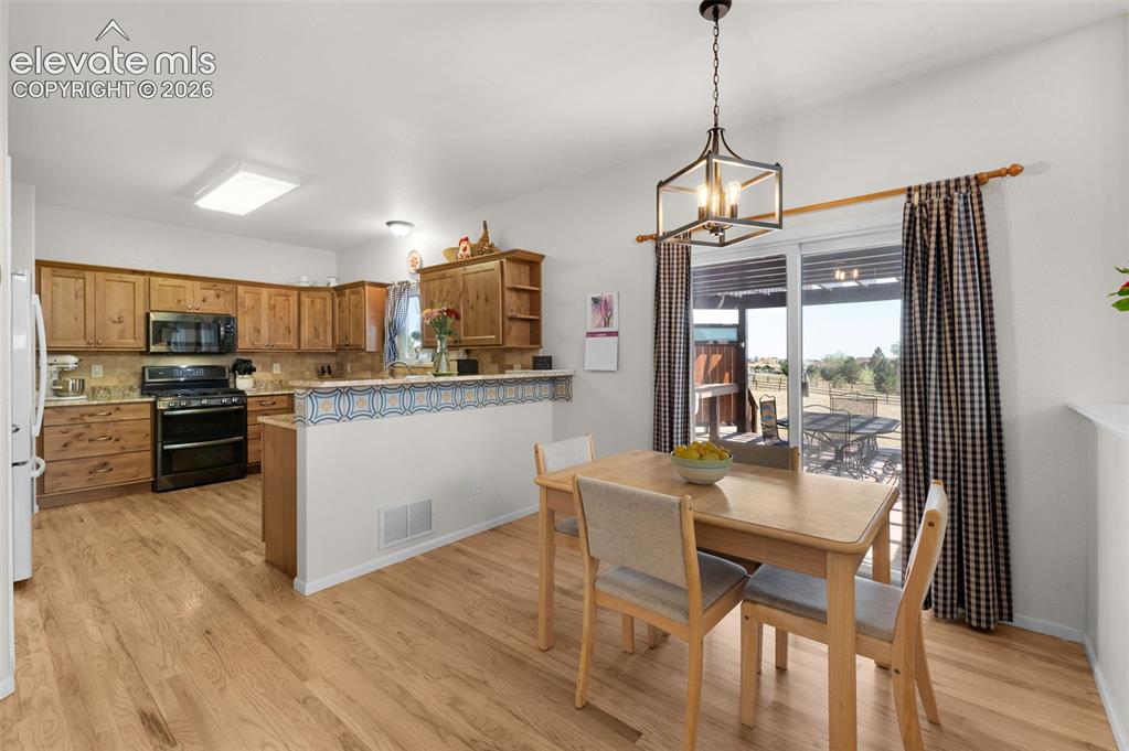 Image 8 of 50: Breakfast Nook Opens To Rear Patio