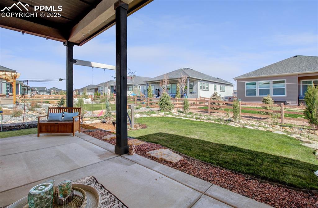 Image 35 of 48: The 10 x 24 covered patio overlooks the beautifully landscaped yard
