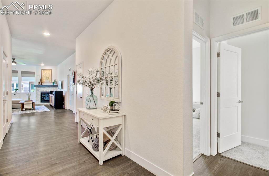 Image 4 of 48: Spacious entry with wood laminate flooring