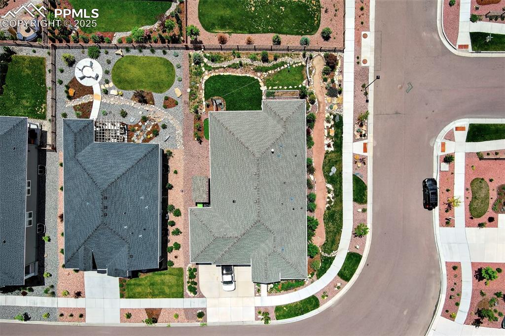 Image 41 of 48: Aerial View showing the landscaped corner lot of the home