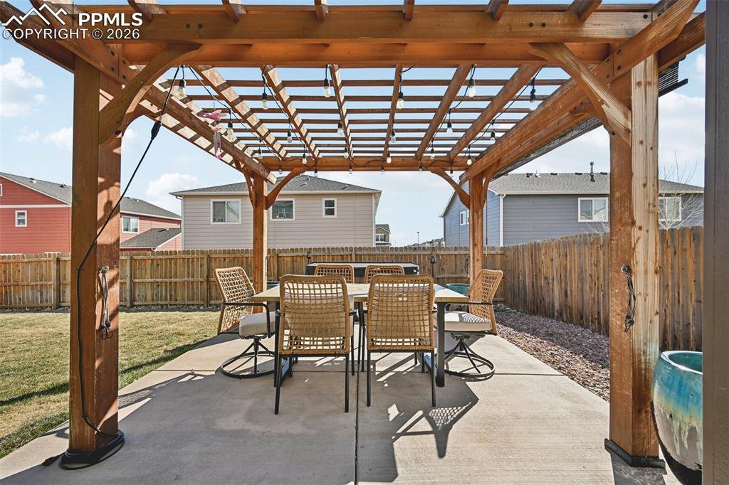 Image 44 of 48: Patio with pergola
