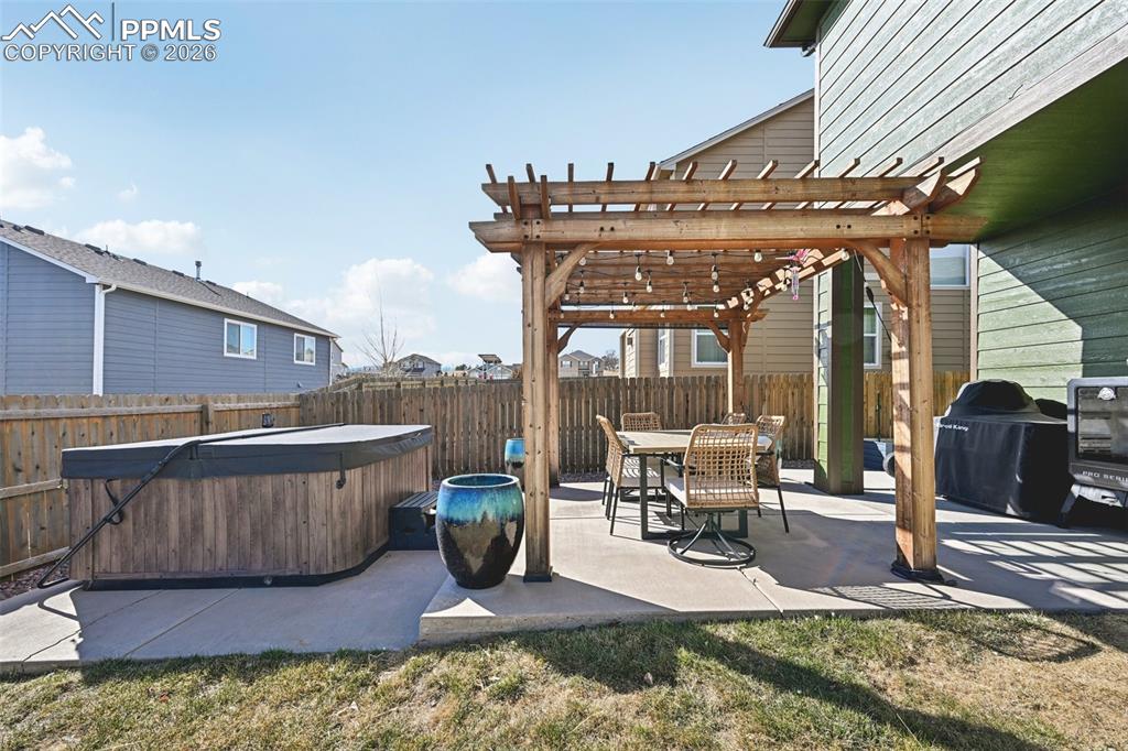 Image 46 of 48: Patio with pergola