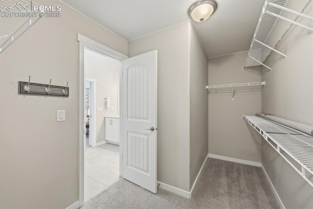 Image 25 of 44: Primary Walk In Closet