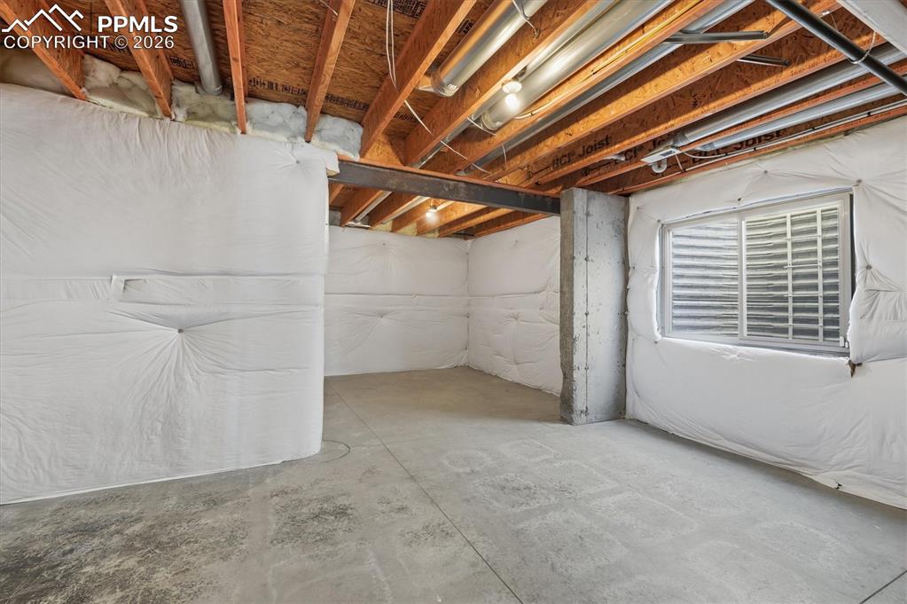 Image 35 of 44: Unfinished Space plumbed for a bathroom
