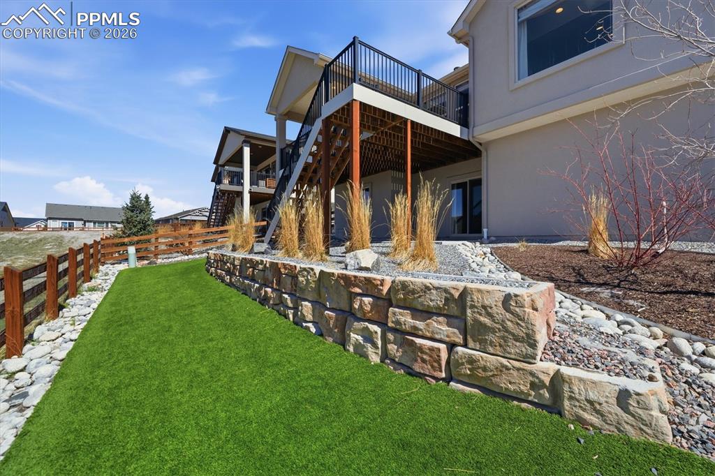 Image 40 of 44: Backyard with Synthetic Turf- Low maintenance and saves on water!