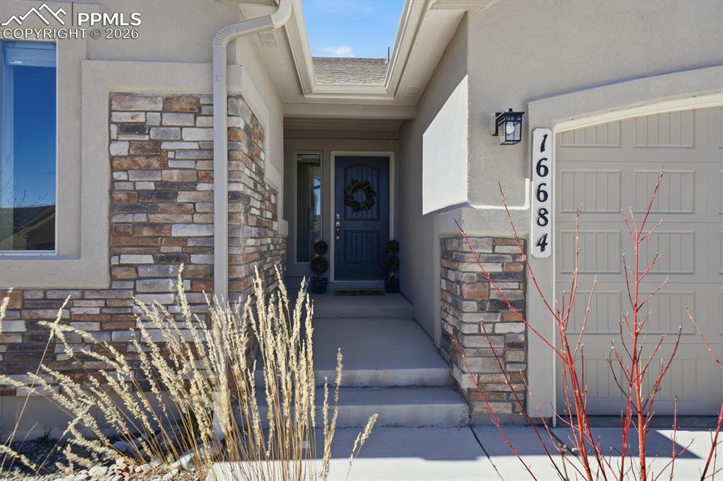 Image 43 of 44: Upgraded Elevation- Stucco and Stone Exterior