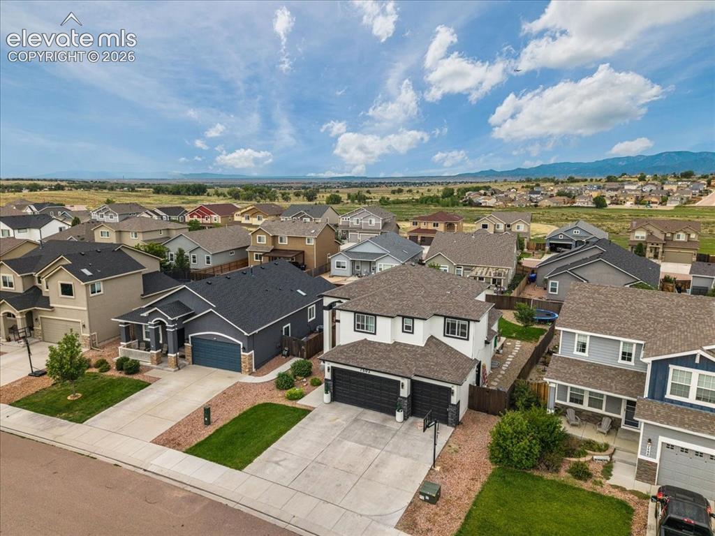 Image 30 of 39: Expansive residential development with mountain scenery