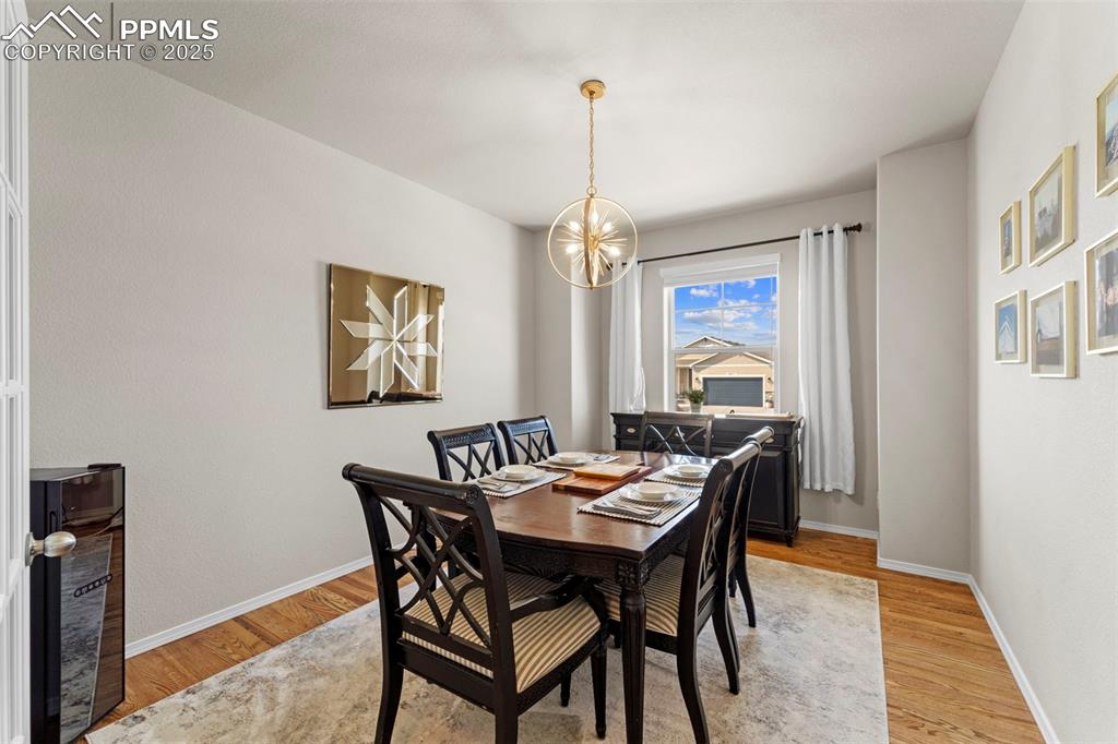 Image 18 of 46: When the chandelier is as much a guest as the entrée.