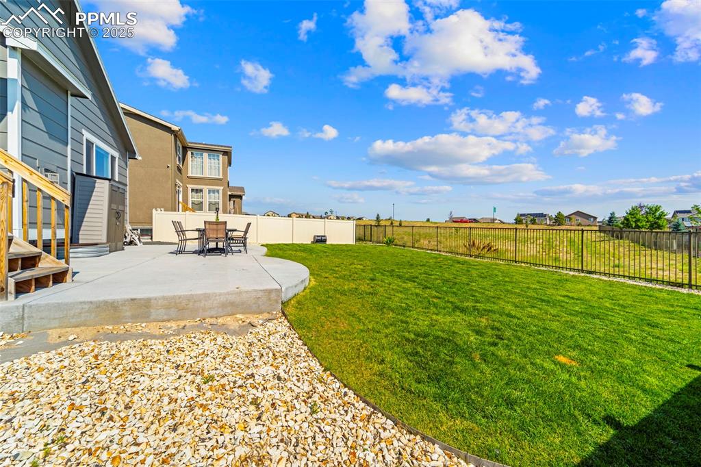 Image 36 of 46: Grill here, garden here, stargaze here—this yard does it all.