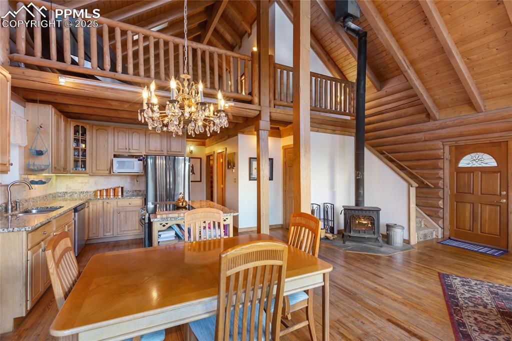 Image 12 of 34: Dining space fits right in to give you full advantage of the wood burning