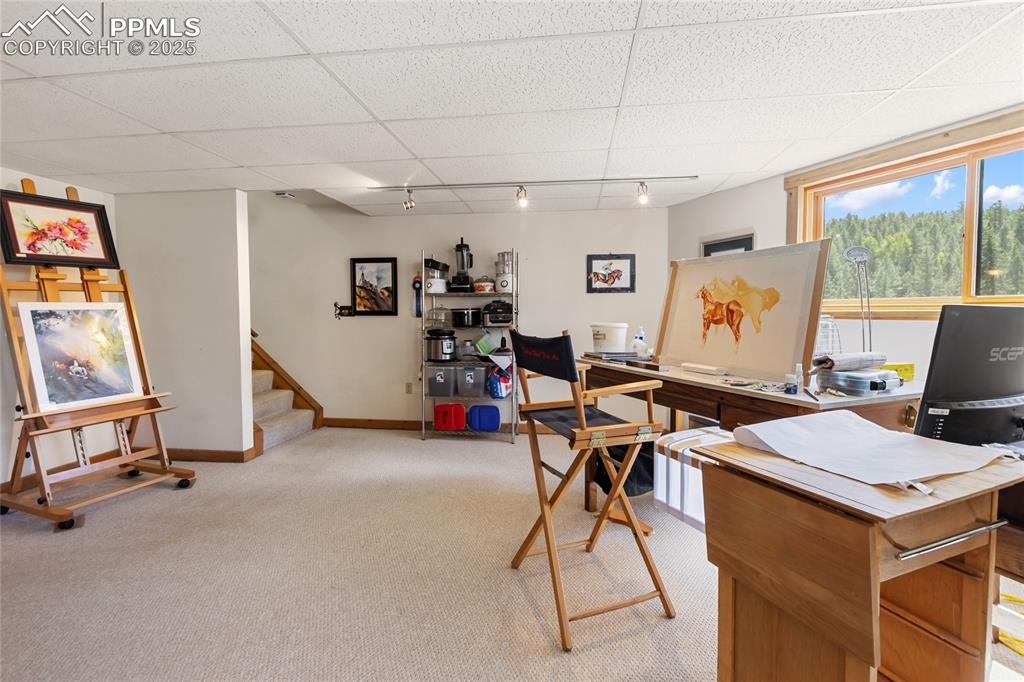 Image 23 of 34: Come downstairs and take in this bright