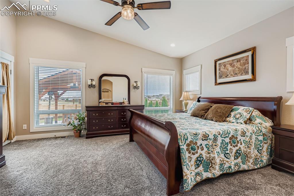 Image 11 of 42: Private master suit on the main level also features a walk out to the outdo