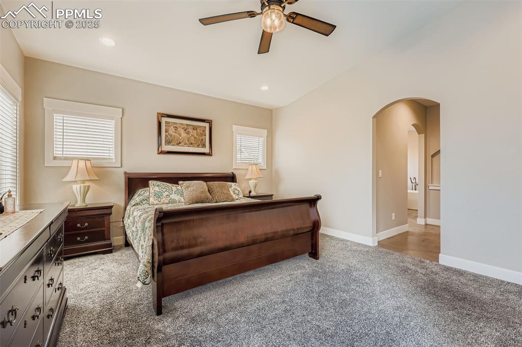 Image 12 of 42: The primary suite is a true retreat, featuring direct patio access, a spa-i