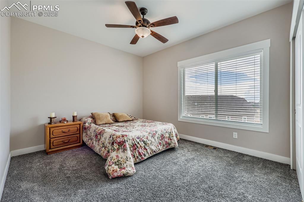 Image 17 of 42: Upper-level west bedroom with gorgous