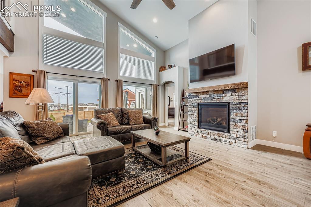 Image 2 of 42: The open-concept living room features abundant natural light and flows seam