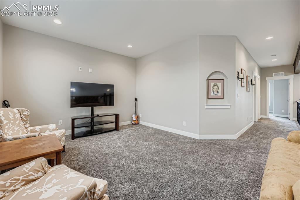 Image 21 of 42: Upstairs, the home offers two generously sized bedrooms, a full bathroom, a