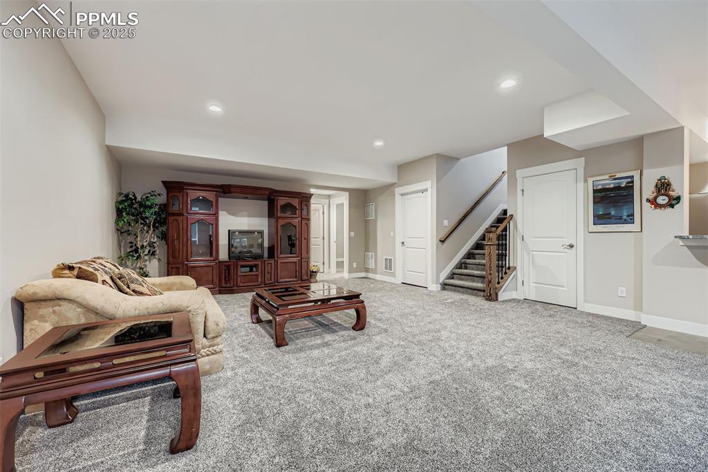 Image 24 of 42: The finished basement expands the living options even further with nine-foo