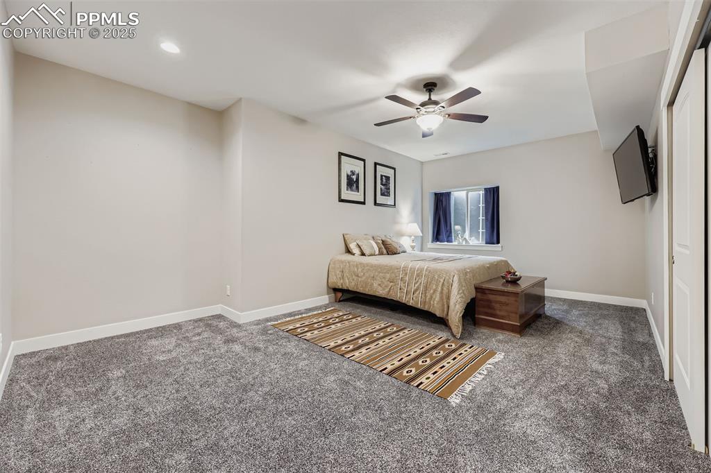 Image 29 of 42: Basement guest JR suite has plenty of space and it adjoins a full bathroom.