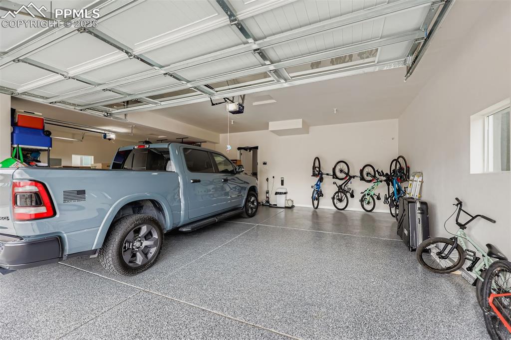Image 36 of 42: Plenty of room for vehicles and gear—this oversized garage comfortably fits