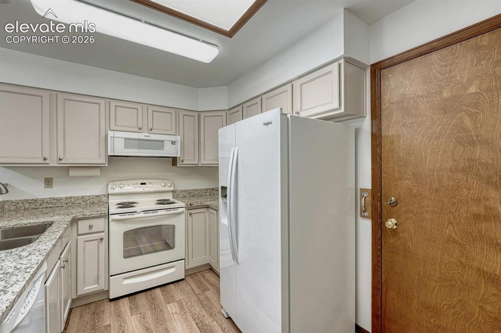 Image 14 of 50: Garage Entry into Kitchen