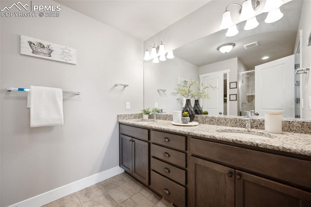 Image 13 of 22: Spa like master bath with two sinks and granite counters!