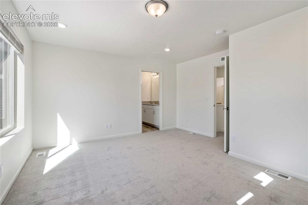 Image 14 of 25: Carpeted flooring, recessed lighting, ceiling-mounted light fixture, single