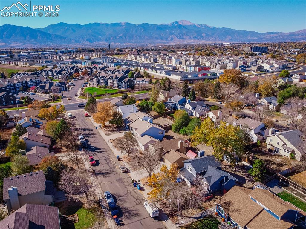 Image 35 of 46: Aerial perspective of suburban area with mountains