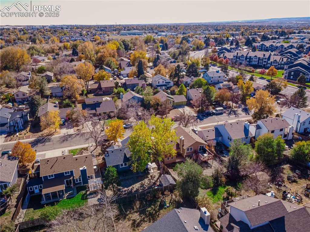Image 44 of 46: Aerial view of property and surrounding area featuring nearby suburban area