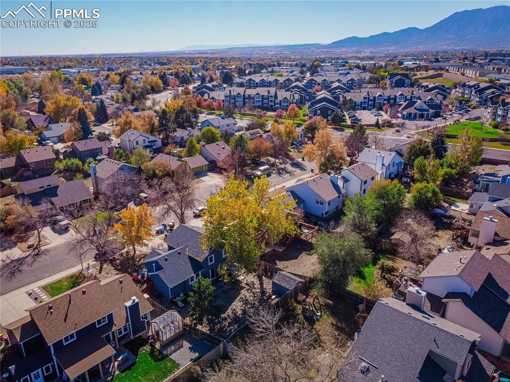Image 46 of 46: Aerial view of property and surrounding area with nearby suburban area and