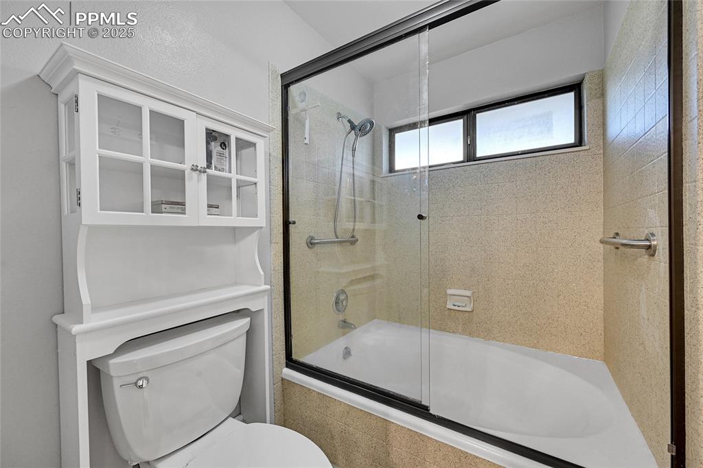 Image 28 of 43: Full bath featuring tiled shower / bath and toilet