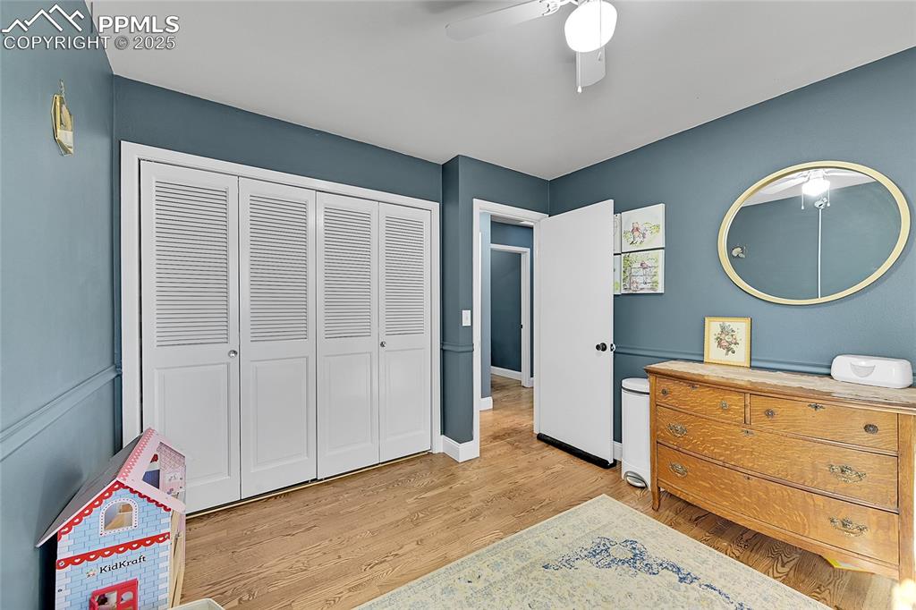 Image 33 of 43: Bedroom featuring light wood-style flooring, a closet, and a ceiling fan