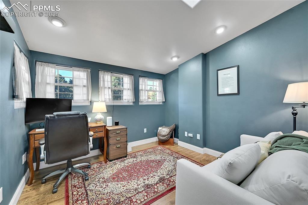 Image 35 of 43: Office area with light wood-type flooring and baseboards