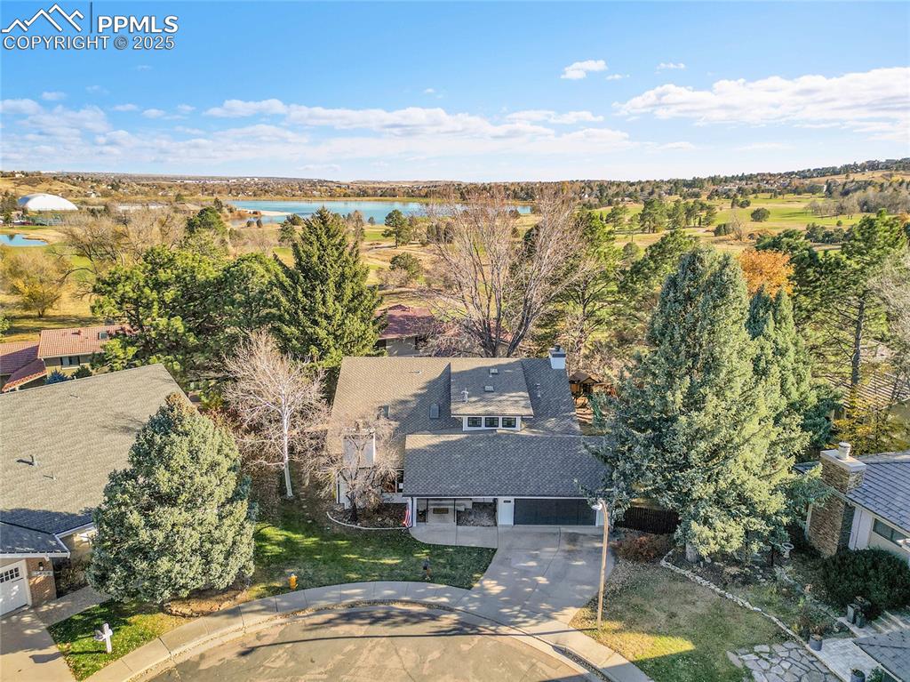 Image 38 of 43: Aerial view of property and surrounding area featuring a large body of wate