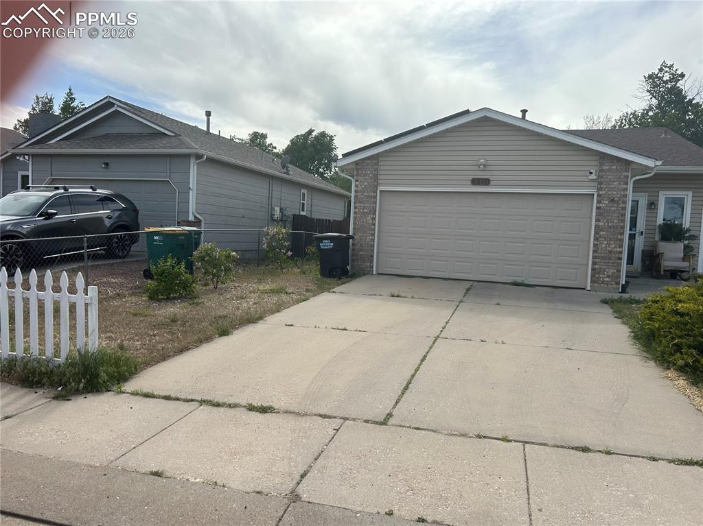 Image 5 of 10: Street front w/ garage left side of the house