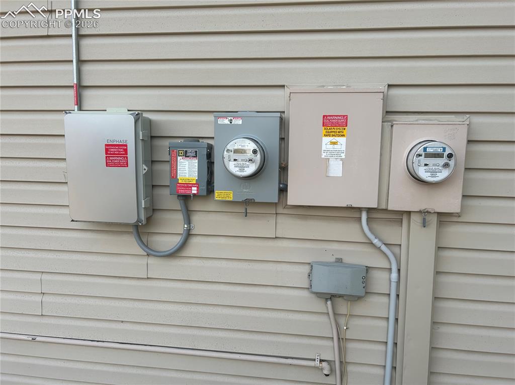 Image 8 of 29: Back yard on house all the utilities