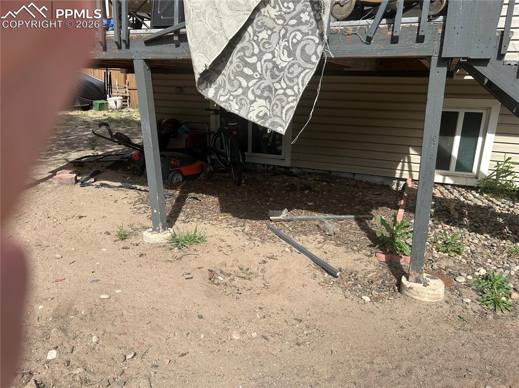 Image 9 of 10: Deck off back of house area under for storage