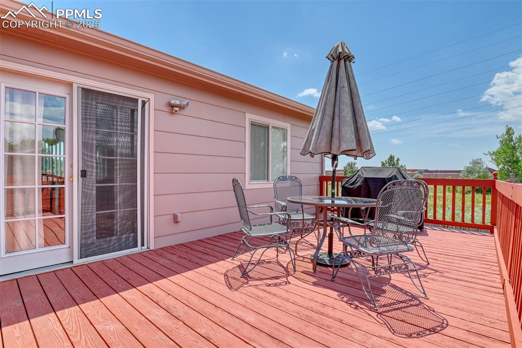 Image 18 of 46: Deck with outdoor dining area