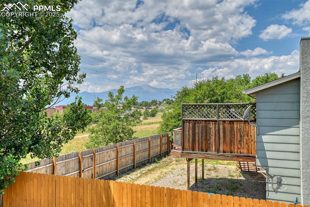 Image 23 of 46: View of fenced backyard