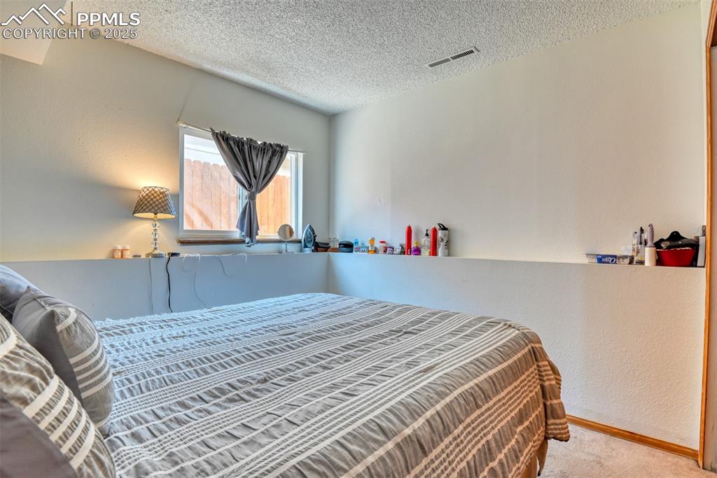 Image 44 of 46: Lower level bedroom